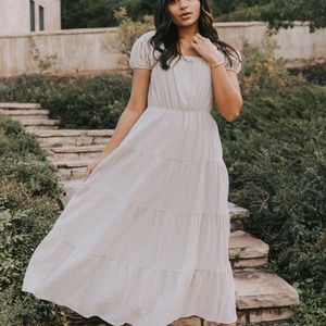 Romantic flowey neutral colored dress. Dress up with heels or down with sandals!